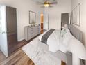 Spacious main bedroom with hardwood floors and a large bed at 8882 Christie Dr, Largo, FL 33771