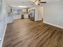 Modern kitchen with stainless steel appliances and wood-look floors at 4409 W Leila Ave, Tampa, FL 33616