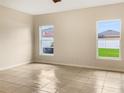 Spacious bedroom with tile flooring and ample natural light at 11334 Hudson Hills Ln, Riverview, FL 33579