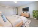 Comfortable bedroom with plush carpet, closet, and dresser, providing a serene retreat at 3444 97Th E Ln, Palmetto, FL 34221