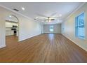 Spacious open-concept living room featuring hardwood floors and abundant natural light at 3444 97Th E Ln, Palmetto, FL 34221