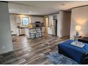Open-concept living area with a modern kitchen, dining space, and comfortable living room at 1386 Ibis Dr, Englewood, FL 34224