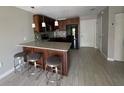 Modern kitchen with stainless steel appliances and granite countertops at 1860 Massachusetts Ne Ave # 214, St Petersburg, FL 33703