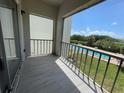 Private balcony overlooking the community pool and lush landscape at 1860 Massachusetts Ne Ave # 214, St Petersburg, FL 33703