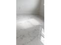 Bright white marble-look tile flooring at 63 Coxswaine Cir, Placida, FL 33946