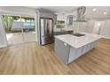 Modern kitchen with stainless steel appliances and a large island at 1900 63Rd S Ave, St Petersburg, FL 33712