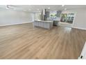Open concept living area with modern kitchen and island at 1900 63Rd S Ave, St Petersburg, FL 33712
