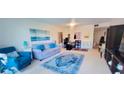 Living room features a sofa, rug, and home office space at 531 Spring Lakes Blvd # 531, Bradenton, FL 34210