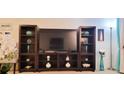 Large entertainment center with TV and shelving at 531 Spring Lakes Blvd # 531, Bradenton, FL 34210