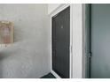 Condo building's front door with security features at 811 N Keene Rd # V7, Clearwater, FL 33755