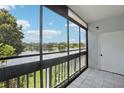 Screened balcony overlooking a lake at 811 N Keene Rd # V7, Clearwater, FL 33755
