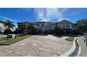Attractive townhome exterior with paved driveway and landscaping at 7224 Ketch Pl, Bradenton, FL 34212