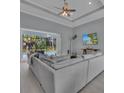 Spacious living room with sliding doors opening to the pool at 111 Long Meadow Ln, Rotonda West, FL 33947