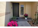 Front entry with screen door and potted plants at 3601 57Th Avenue W Dr # 31, Bradenton, FL 34210