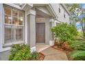 Front entrance of charming house with landscaping at 2111 Tetley Ct, Brandon, FL 33510