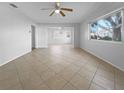 Bright living room with tile flooring and neutral walls at 2413 Riverbluff Pkwy # V-231, Sarasota, FL 34231