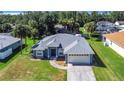 Single-Gathering home with a spacious backyard and driveway at 2863 Tishman Ave, North Port, FL 34286