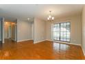 Dining room with wood-look tile flooring and access to patio at 3720 Orangepointe Rd, Valrico, FL 33596
