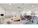 Spacious living room with sectional sofa and large windows at 108 Castile Ct, Punta Gorda, FL 33983