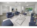Open living room with modern furniture and hardwood floors at 790 Harvard St, Englewood, FL 34223