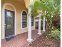 Elegant front entrance with arched entryway and brick walkway at 8231 Dunham Station Dr, Tampa, FL 33647