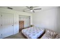 Bedroom with a double bed, dresser, and closet at 10255 Norwick St, Spring Hill, FL 34608