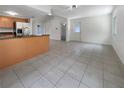 Open concept dining area with tile floor and kitchen access at 3451 Sage St, Port Charlotte, FL 33948