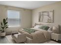 Main bedroom with neutral tones and window blinds at 4916 White Sanderling Ct, Tampa, FL 33619