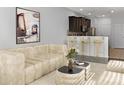Open living room with contemporary furniture and kitchen view at 4916 White Sanderling Ct, Tampa, FL 33619