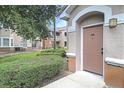 Exterior view of condo building showcasing manicured landscaping and private entrance at 10407 Villa View Cir # 10407, Tampa, FL 33647