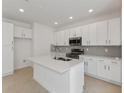 Modern kitchen with white cabinets and quartz countertops at 17314 Alderwood Ln, Punta Gorda, FL 33982