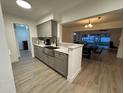 Modern kitchen with gray cabinets, quartz countertops, and stainless steel sink at 4469 Cunningham St, Port Charlotte, FL 33948