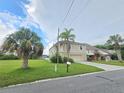 Two-story house with a large yard and attached garage at 3263 Sea Grape Dr, Hernando Beach, FL 34607