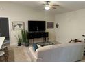Spacious living room with a large TV and comfortable seating at 3529 65Th Avenue E Cir, Sarasota, FL 34243