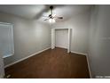 Bright bedroom with wood-look flooring and a double door closet at 6115 Sand Key Ln, Wesley Chapel, FL 33545