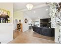 Bright and spacious entryway offering views into the living room and kitchen at 12377 Fillmore St, Spring Hill, FL 34609