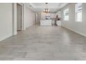 Spacious dining room with tile floors and an open view to the kitchen at 7615 Campus Cv, Sarasota, FL 34243