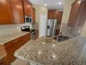 Kitchen with granite countertops and stainless steel appliances at 7001 Interbay Blvd # 210, Tampa, FL 33616