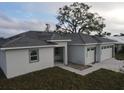 New construction home with a three car garage and paver driveway at 399 Giovanni Dr, Nokomis, FL 34275