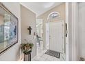 Bright entryway with a view into dining area, and decorative elements at 7319 Eleanor Cir, Sarasota, FL 34243
