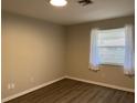 Bright bedroom with neutral walls and wood flooring at 624 Golden Raintree Pl # 624, Brandon, FL 33510