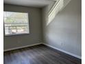 Spacious bedroom with large window and wood flooring at 624 Golden Raintree Pl # 624, Brandon, FL 33510