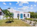 Charming Spanish style home with a teal door and walkway at 1101 22Nd N Ave, St Petersburg, FL 33704