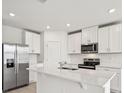 Modern kitchen boasts stainless steel appliances and an island at 164 Lazy Shore Dr, Nokomis, FL 34275