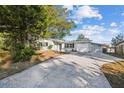 Single story home with a large tree in the front yard at 11357 116Th Ave, Largo, FL 33778
