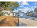 House exterior showcasing a gray house with a white garage door at 11357 116Th Ave, Largo, FL 33778