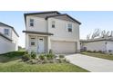 Charming two-story home featuring a two car garage and neutral siding at 3910 Radiant Mountain Dr, Plant City, FL 33565