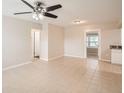 Bright living room with tile floors and ceiling fan at 6445 Skyline Ct, Spring Hill, FL 34606