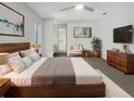 Main bedroom with a king-size bed, ensuite bathroom, and plenty of closet space at 18978 Mcgrath Cir, Port Charlotte, FL 33948