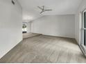 Spacious living room with neutral carpeting and ample natural light at 18978 Mcgrath Cir, Port Charlotte, FL 33948